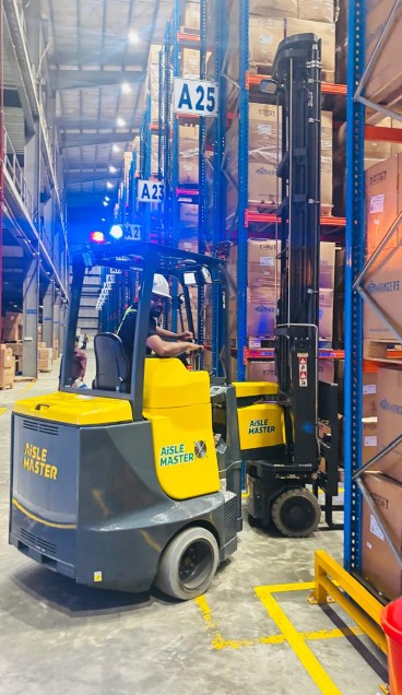 Forklift in a high-bay warehouse