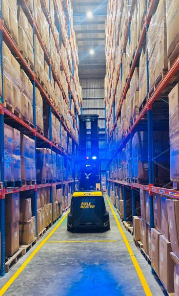 Warehouse aisle with order picker